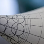 Rhian Malin decorating a mandala bottle in her workshop 2019